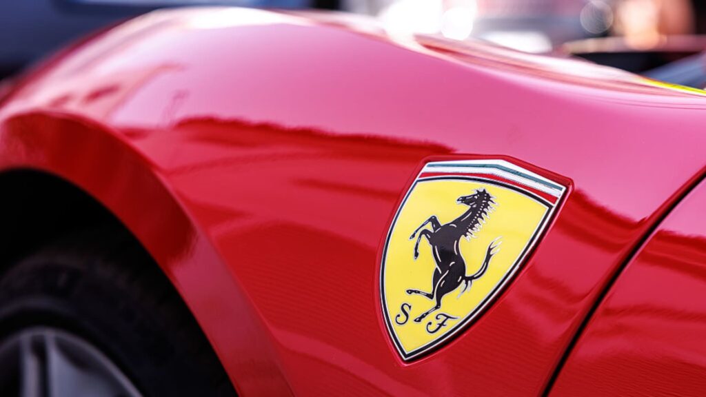 Ferrari unveils first electric vehicle and cuts 2030 EV sales target
