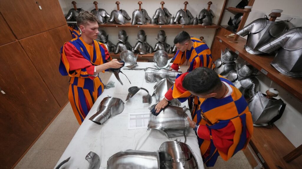 A look at Swiss Guards preparing for a swearing-in ceremony attended by the Pope, in photos
