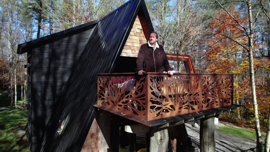 He bought 5 acres of land for $27,000, built 3 cabin rentals