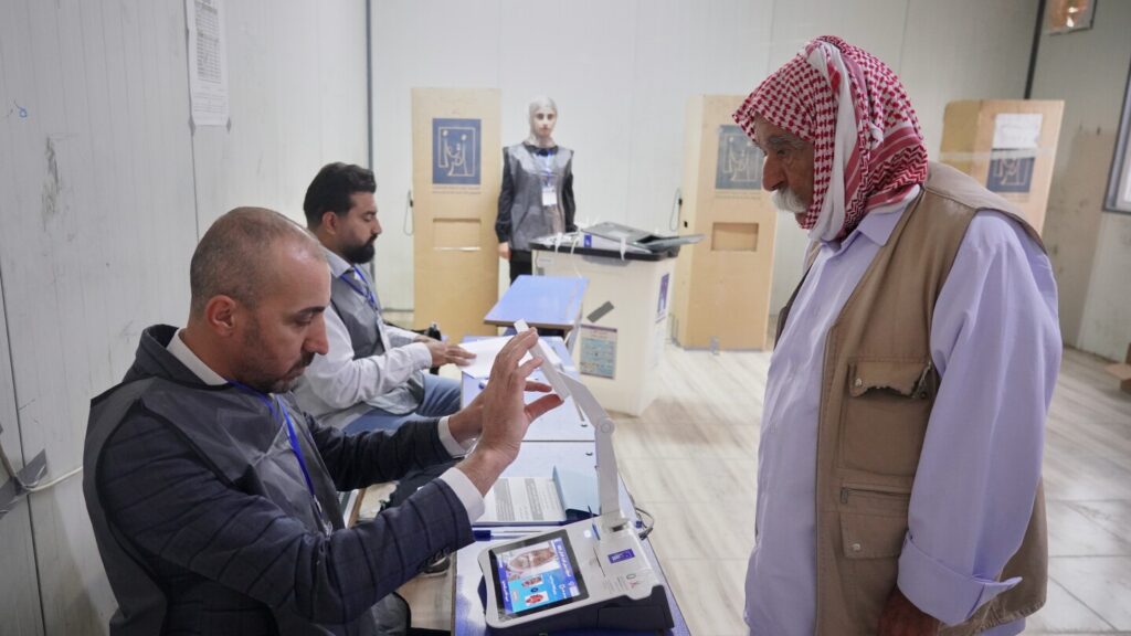 Iraqi security forces and displaced people vote in parliamentary election
