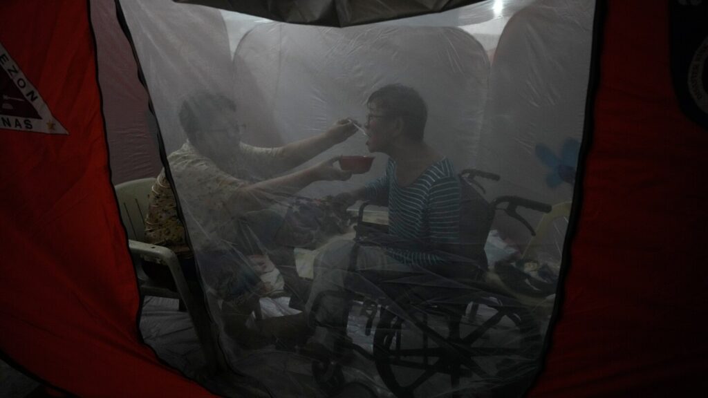 One photo that captures tenderness amid chaos in the Philippines as Typhoon Fung-wong hits