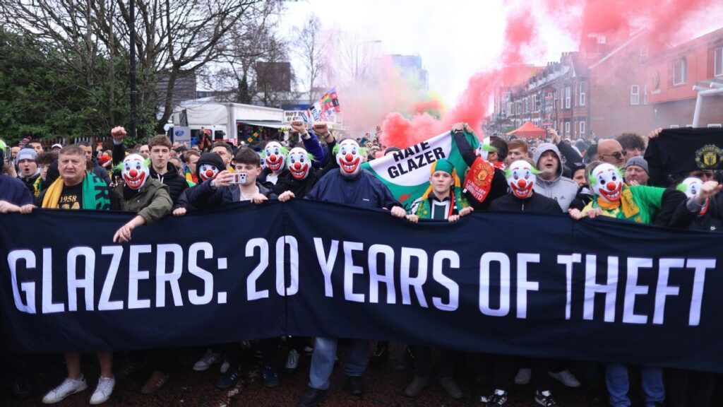 Man United fans don clown masks in protest against owners, ‘circus’